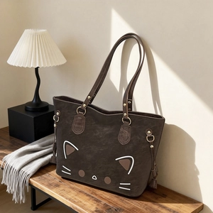 Große dunkelbraune Shopper-Tasche mit süßem Katzengesicht und schicken Gold-Beschlägen