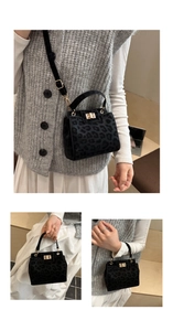Detail of leopard print crossbody bag with metal twist lock and soft faux fur texture