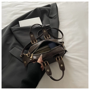 Interior view of vintage dark brown bowling bag showing spacious storage for wallet and makeup