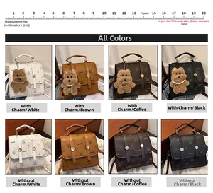 Detail view of crocodile-pattern faux leather bags in four colors with bear pendant charm