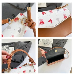 Detail shots of cherry print square bag showing knotted handle and magnetic closure