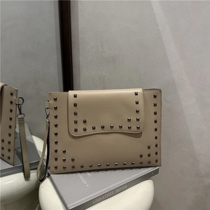 Vintage beige rivet shoulder bag with envelope flap and metal chain strap details