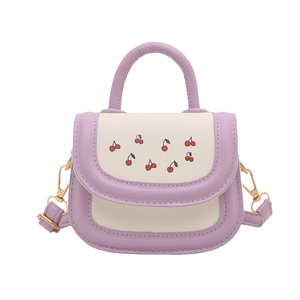 Mini color-block cherry print crossbody bag with purple handle and cream faux leather