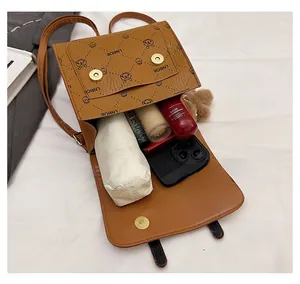 Detailed view of the brown printed backpack interior showing large storage capacity