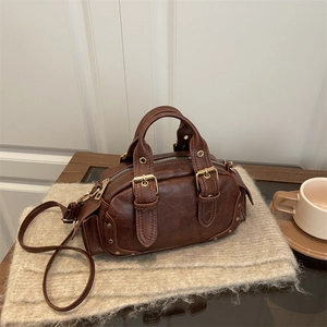 Vintage dark brown Boston bowling handbag in textured leather with gold buckle detail