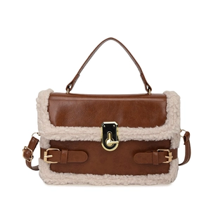 Brown faux leather crossbody bag with cream lamb wool trim and gold metal lock detail