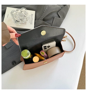 Interior view showing the large capacity of caramel crossbody bag with magnetic buckle