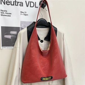 Chic red faux leather hobo tote bag with a minimalist design for women's daily commute