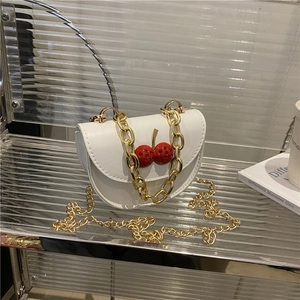 Elegant white semi-circle crossbody bag with red cherry charm and dual gold chains