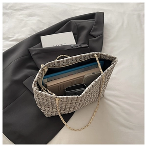 Spacious plaid tweed tote bag showing interior storage for tablets and books
