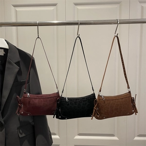 Three bow-tie baguette bags in burgundy, black and brown with leopard texture