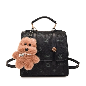Vintage black texture leather backpack with LNBOE prints and a cute plush doll pendant