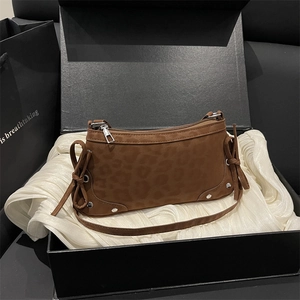 Fashionable leopard print suede shoulder bag with ribbon bows and silver rivets in a gift box