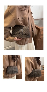 Detail view of vintage brown crossbody bag featuring all-over M pattern and silver buckle