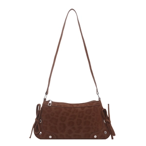 Brown leopard print shoulder bag with bow accents and silver studs on white background
