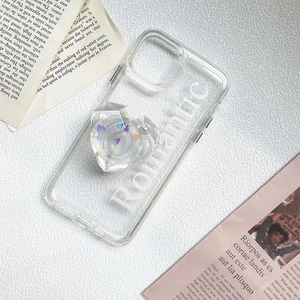 Macro view of clear heart phone grip with romantic text on a transparent case