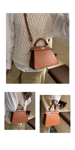 Detailed side view of caramel leather handbag featuring multi-layer gusset design and gold lock
