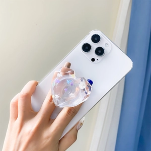 Detail of heart-shaped clear phone socket with colorful sequins and diamond texture