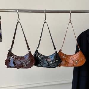 Retro Y2K crescent shoulder bags with studs in brown, black, and orange colors