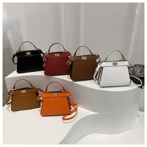 Six colors of stylish trapezoid handbags featuring gold twist locks and long straps