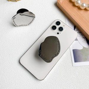 Metallic irregular pebble phone socket stand with silver mirror finish and engraving