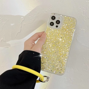 Close-up of yellow glitter iPhone case with matching circular silicone wrist strap
