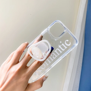Detail of a transparent phone case with a marble pearl socket and Romantic text