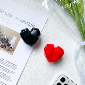 Minimalist heart-shaped geometric phone grip holder in black and red glossy finish
