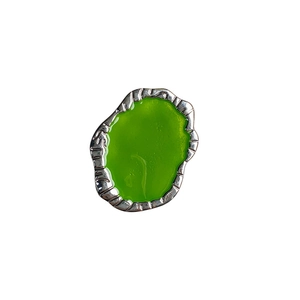 Minimalist silver fluid-shaped metal phone grip with vibrant green enamel inlay