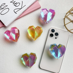 Faceted heart-shaped iridescent cell phone grip with colorful gradient resin finish