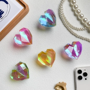 Macro detail of colorful heart-shaped expanding phone sockets with 3D faceted cut surface