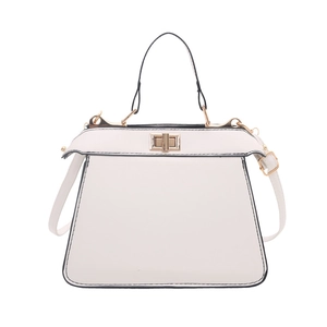 Classic white trapezoid handbag with gold twist lock and black contrast edge trim