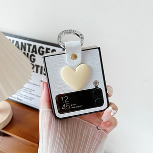 Detail of Galaxy Z Flip case with 3D heart, leather strap, and diamond ring holder