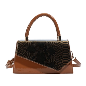 Brown patent leather shoulder bag with snakeskin pattern flap and gold hardware accents