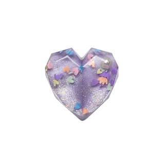 Sparkly purple resin heart phone grip with glitter, colorful sequins and a white pearl accent