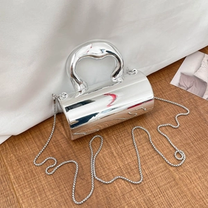 Silver metallic mini shoulder bag with glossy mirror finish and cylindrical design