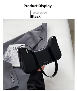 Detail of black leather half-moon bag with adjustable strap and metal zipper