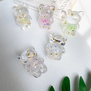 Detailed view of colorful glitter bear phone grips with Sweet text in 5 pastel shades