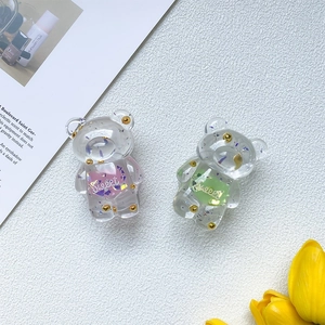 Detailed view of translucent bear-shaped resin grips with colorful filler and Sweet text