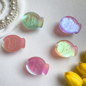 Detail view of colorful 3D laser fish phone grips with frosted gradient textures