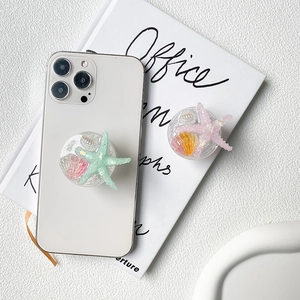 Glittery ocean shell and starfish collapsible phone grip stand for smartphones
