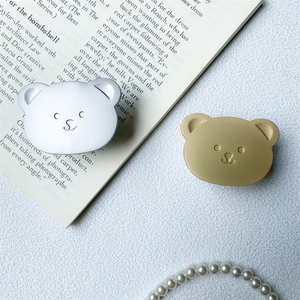 Cute bear-shaped expandable phone socket grip in glossy silver and matte gold finish