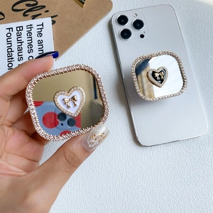 Luxury rhinestone mirror phone socket grip with heart and bow design in black and white