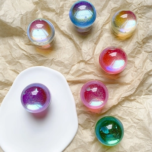Macro detail of colorful holographic resin phone sockets with sparkling glitter finish