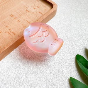 Detail of laser fish phone socket with 3D scales and a shimmering pearlescent finish
