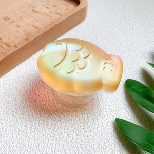 Detailed macro view of 3D fish shaped phone grip with orange gradient resin texture