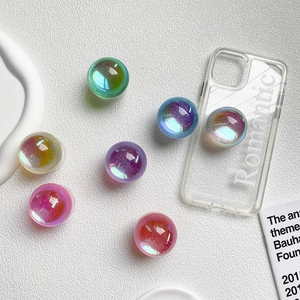 Detailed view of colorful translucent crystal ball phone sockets with glittering sequins