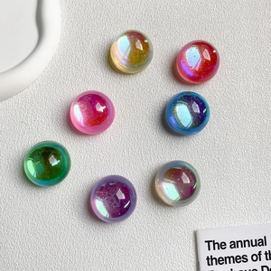 Set of seven iridescent round crystal ball phone stands in assorted vibrant colors
