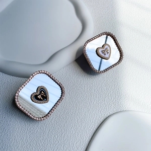 Close-up of heart patterned mirror phone sockets with sparkling rhinestone frames
