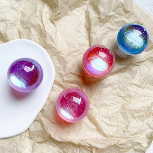 Macro view of crystal glitter phone socket grips in purple and pink starry resin
